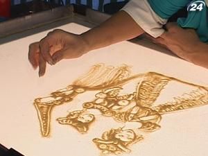 Казку "Спляча красуня" художниця малювала з піску під Чайковського Казку "Спляча красуня" художниця малювала з піску під Чайковського