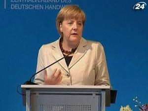 Меркель: Поддержать евро - обязанность Германии