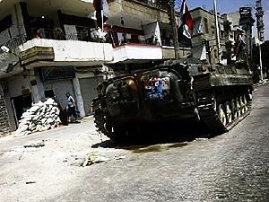 Жертвами боев между военными и оппозиционерами в Сирии стали более 30 человек Жертвами боев между военными и оппозиционерами в Сирии стали более 30 человек