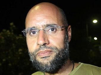 Син Каддафі пропонував 2 мільярди за свою свободу Син Каддафі пропонував 2 мільярди за свою свободу