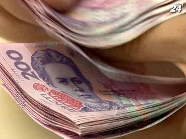 МВФ: Гривня впаде в ціні до 9 за долар