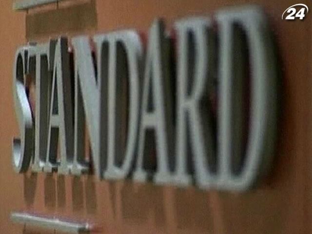 Standard&Poor's понизило рейтинг 11 испанских банков