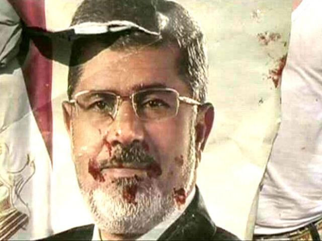 В Египте начался суд над более чем 1200 сторонниками Мурси В Египте начался суд над более чем 1200 сторонниками Мурси