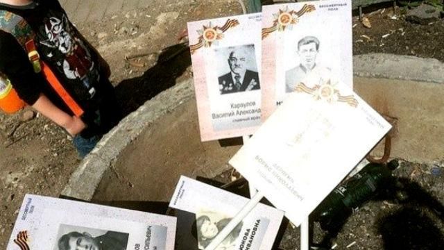 В России после шествия активисты выбросили портреты "дедов, которые воевали", — соцсети