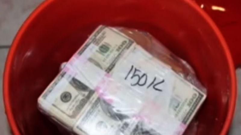 Поліція конфіскувала у наркодилера рекордну суму грошей, які він ховав у відрах
