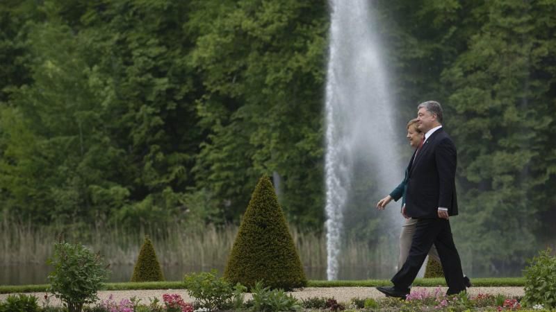 Как Порошенко с Меркель встречался: Цеголко поделился необычными фото Как Порошенко с Меркель встречался: Цеголко поделился необычными фото