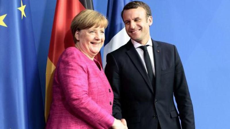Макрон та Меркель обговорили міграційну політику Макрон та Меркель обговорили міграційну політику
