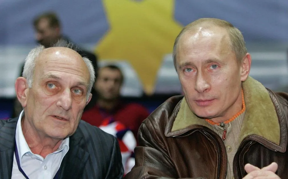 Путін з тренером Анатолієм Рахліном Путін з тренером Анатолієм Рахліном