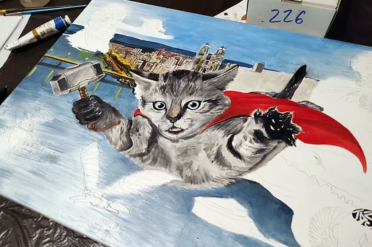Дніпровський художник виставив картину про кота-супергероя на аукціон
