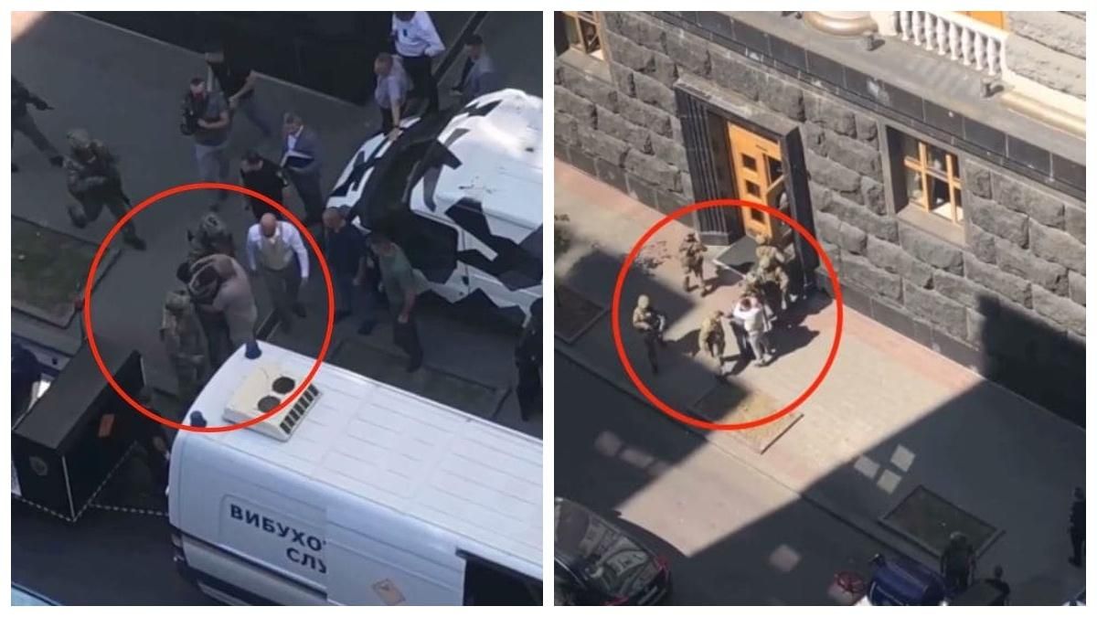 Захоплювача уряду після затримання обійняли 2 людей: фото Захоплювача уряду після затримання обійняли 2 людей: фото