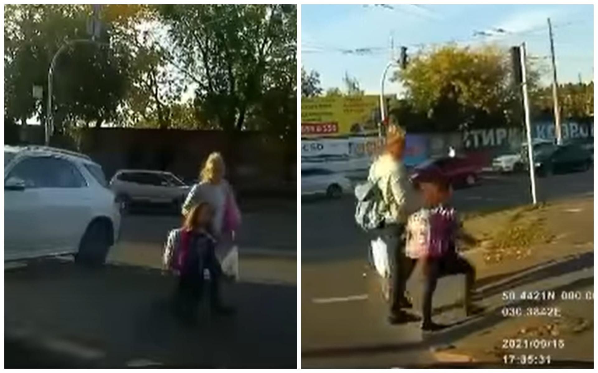 В Киеве мама с ребенком перебегала дорогу на красный свет: видео момента