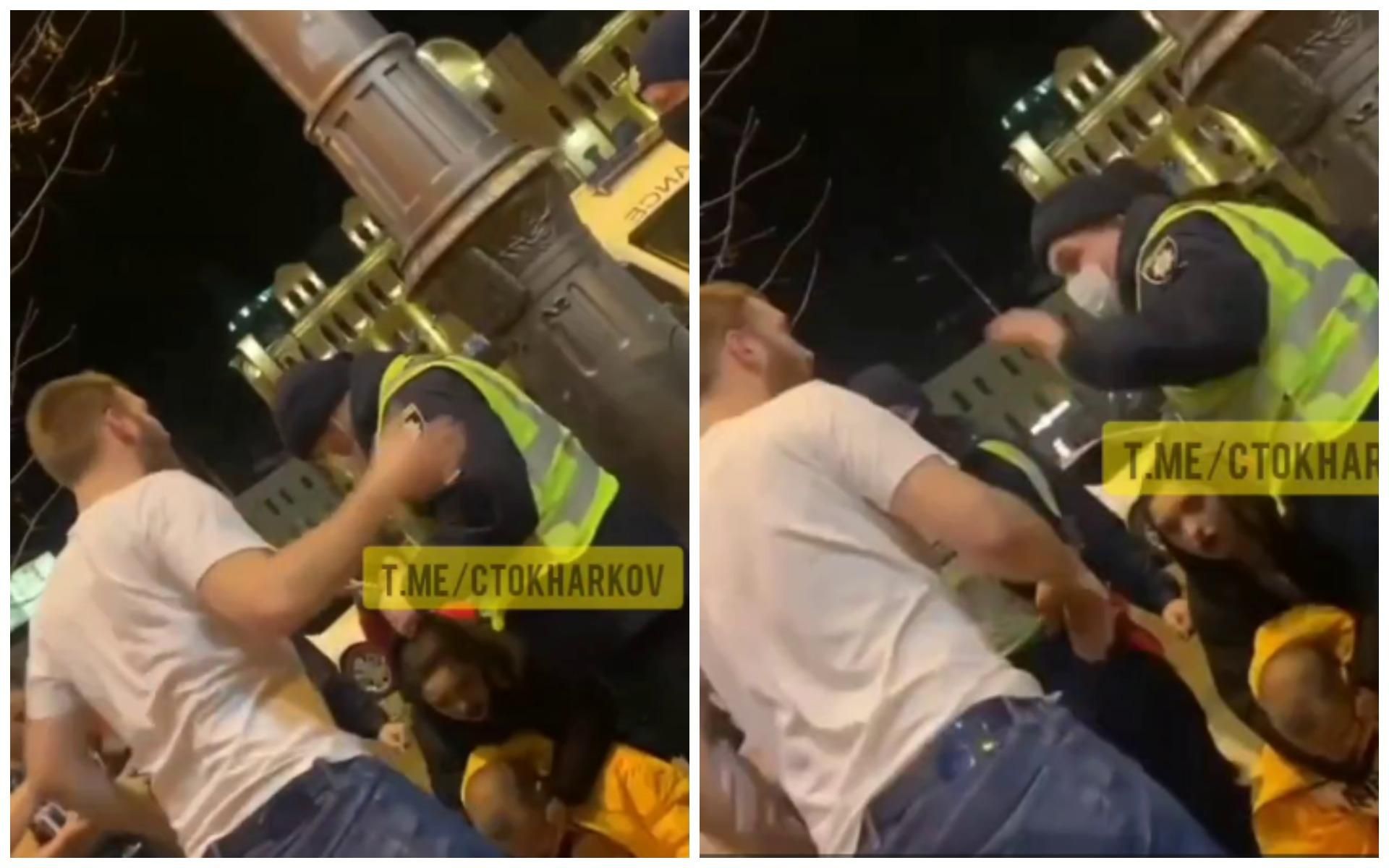Возле харьковского кафе мужчина ударил патрульного по голове: видео инцидента
