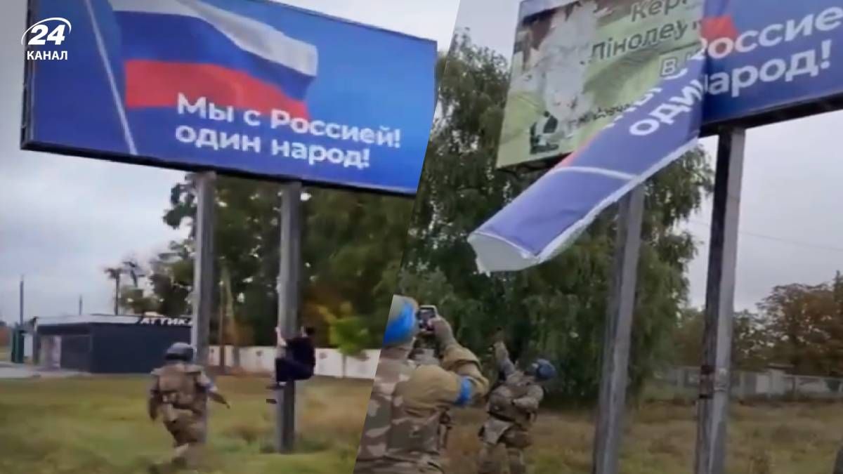 У Вовчанську чоловік заліз на борд - зняв плакат окупантів - відео
