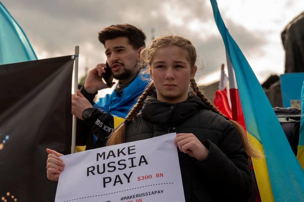 Учасники акції Make Russia Pay