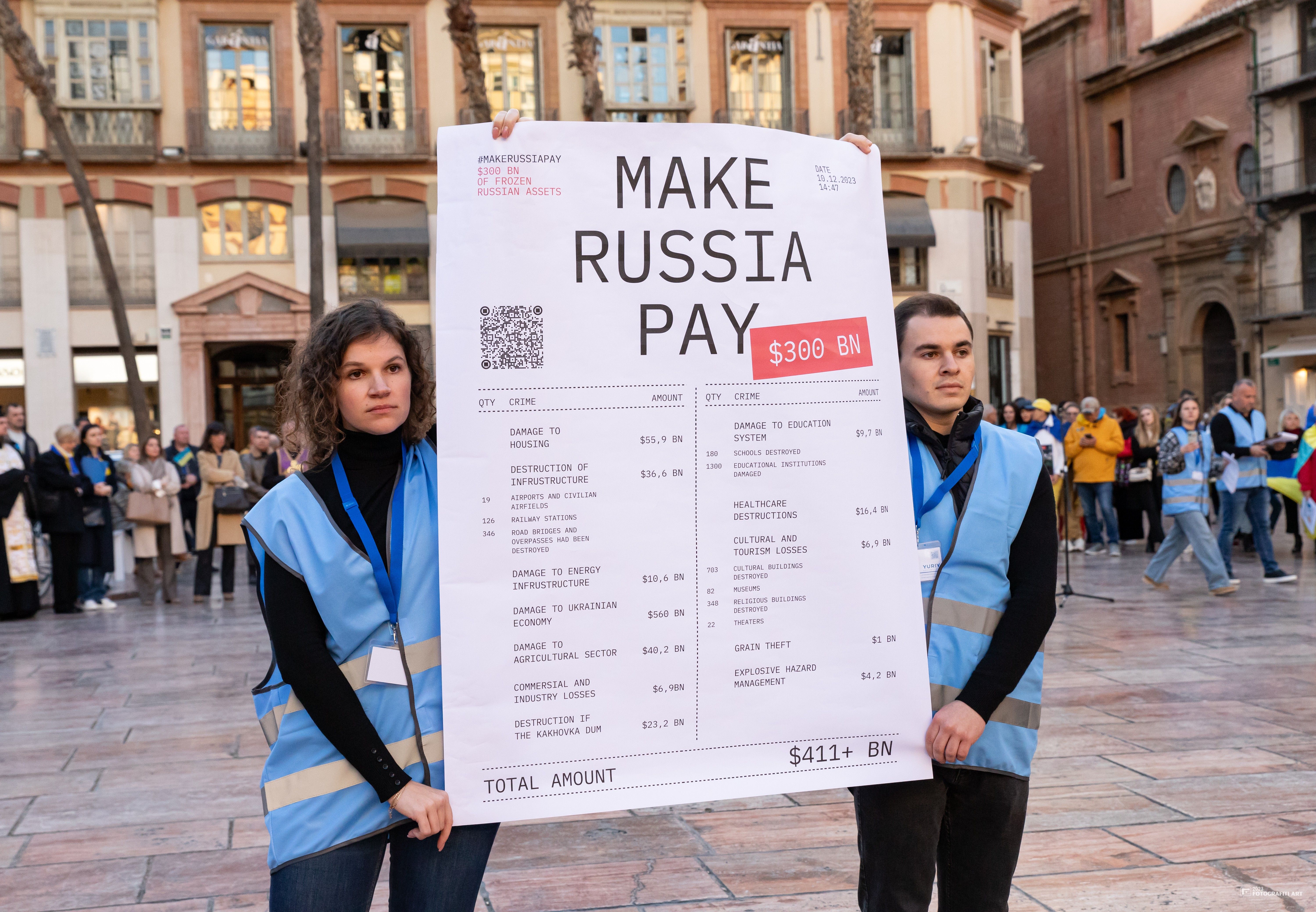 Учасники акції Make Russia Pay