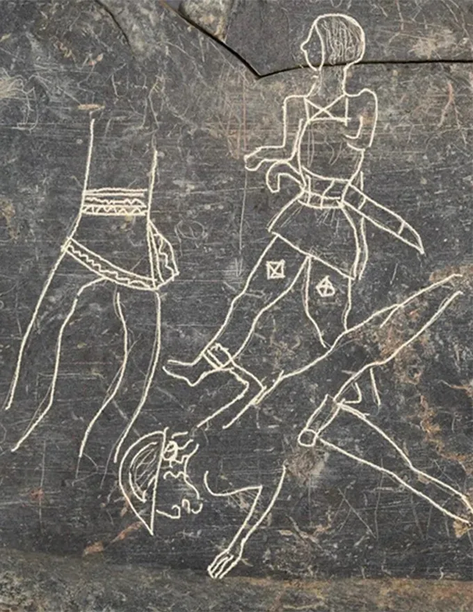 Исследовательница Жоан Феррер-и-Жане заметила палеоиспанское письмо на этой фотографии плиты, на которой были изображены фигуры воинов