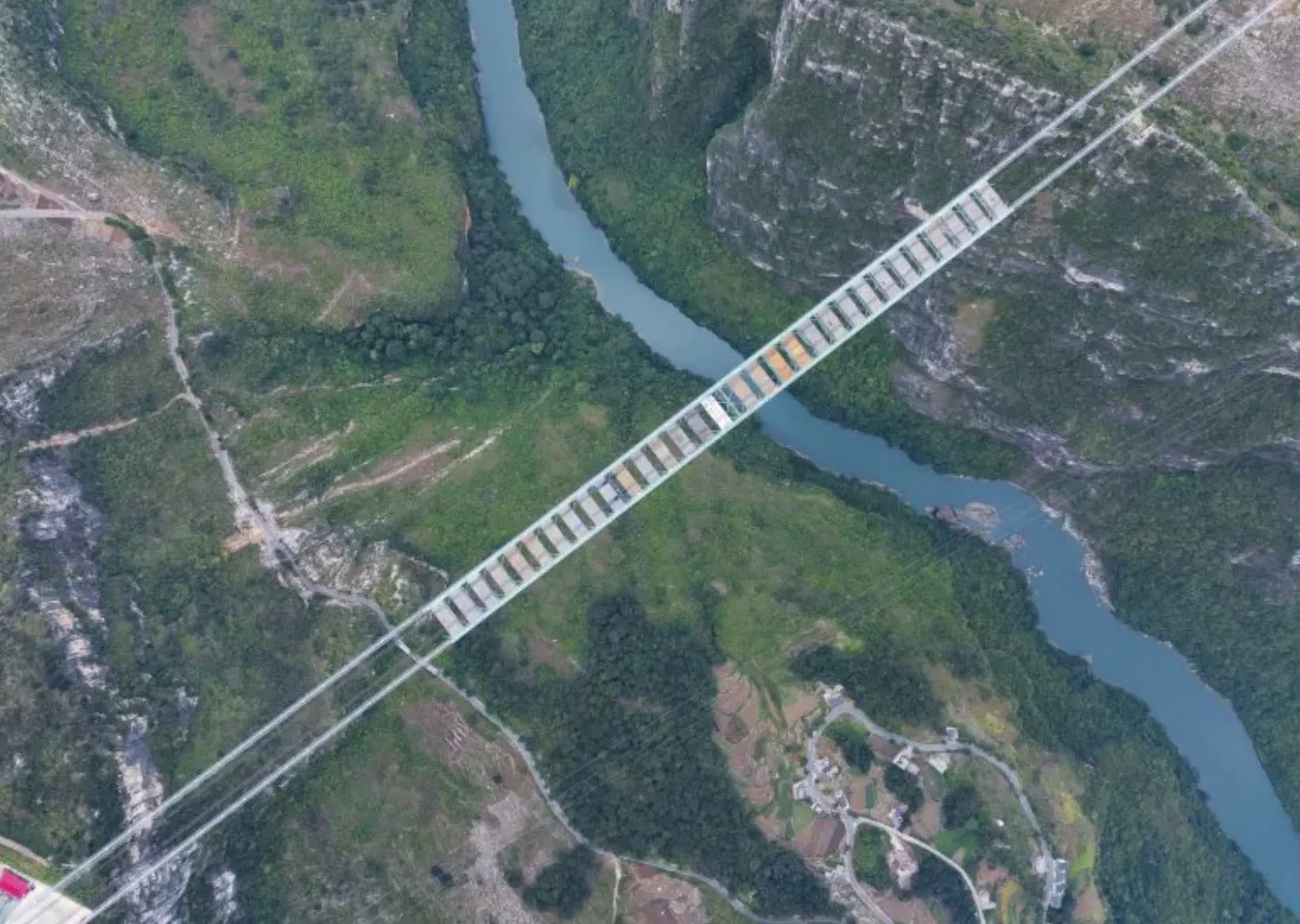 Вид с высоты птичьего полета на мост Хуацзян Гранд Каньон Вид с высоты птичьего полета на мост Хуацзян Гранд Каньон